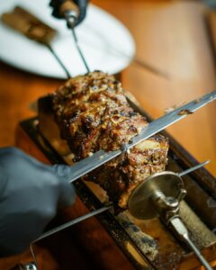 Slices of Cağ Kebab marinating with herbs at Nuz Restaurant in Istanbul.