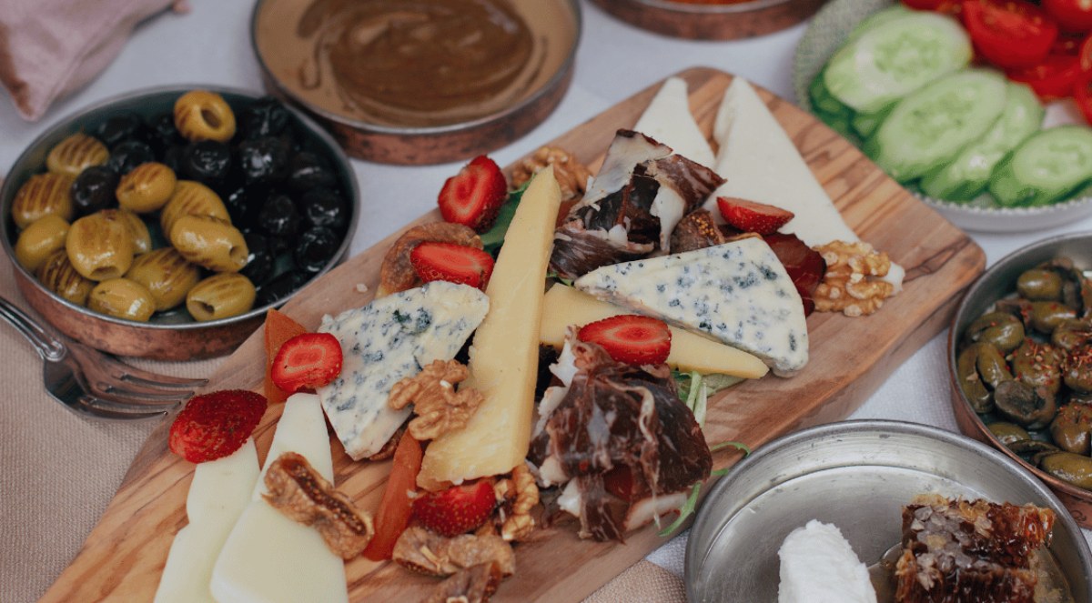 Nuz Restaurant - Anatolian cheese plate served with olives and meze bowls